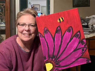 Vicki Tennison displays her art from recreational therapy.
