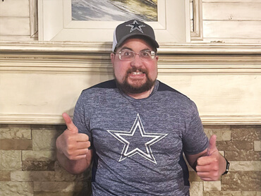 Graham Autry gives two thumbs up after rehabilitation.