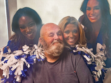 James Lowery smiles during a visit from the Dallas Cowboys cheerleaders.
