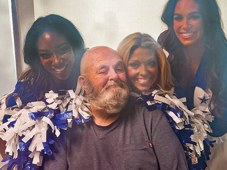 James Lowery smiles during a visit from the Dallas Cowboys cheerleaders.